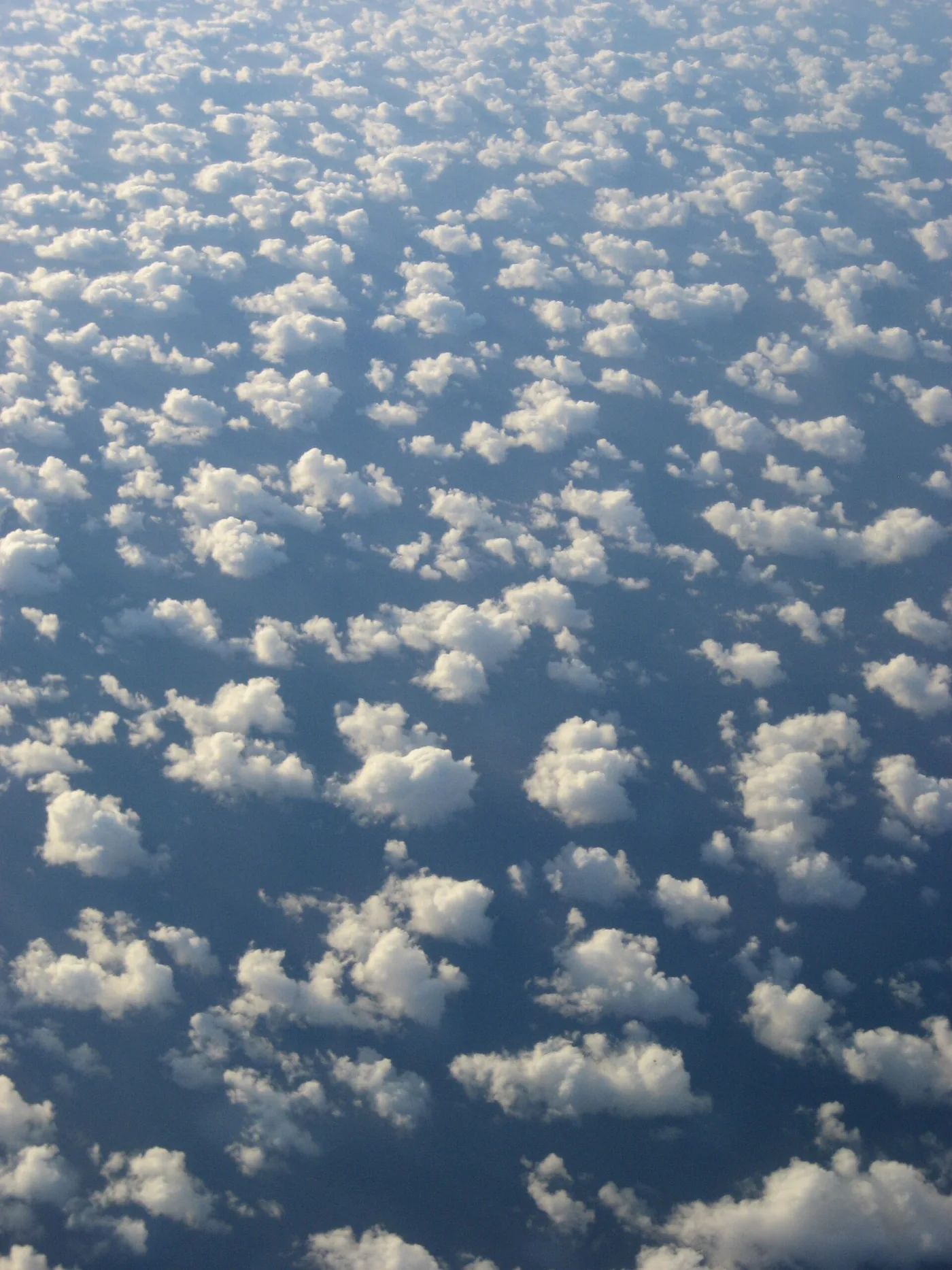 Spectacular Mid-Pacific Clouds somewhere near the Cook Islands on a flight from Auckland, New Zealand to Papee
